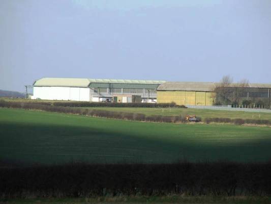 Most southerly 'C' type hangars, looking across from the B1203 at RAF Binbrook, photographed in Feb 2005.